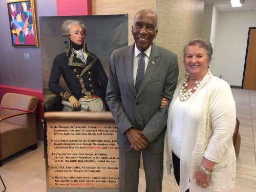 As part of the annual Lafayette Birthday Celebration, Methodist University invited the public to see their Lafayette Collection, which was founded 50 years ago. Their newest acquisition, an 1825 letter written by Lafayette to President James Monroe, was unveiled. Pictured with the lobby display of Lafayette is Willie Wright and Diane Parfitt.