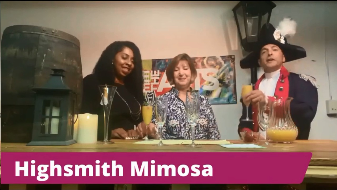 Two women and Lafayette make a toast using "Highsmith" mimosas
