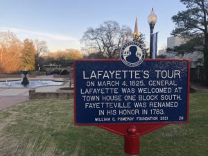 The Lafayette Trail marker in Cross Creek Park at sundown.