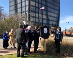 Five men unveiling the Lafayette Trail marker in Cross Creek Park